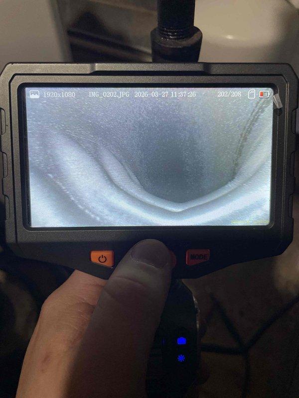Responded to heating maintenance call regarding odor coming from furnace during shutdown cycle. Performed thorough inspection of air handler and heat exchanger using borescope camera to examine internal components and ductwork for potential sources of smell. Visual inspection revealed no visible cracks, debris accumulation, or contamination within the heat exchanger or connected ductwork that would account for reported odor.
