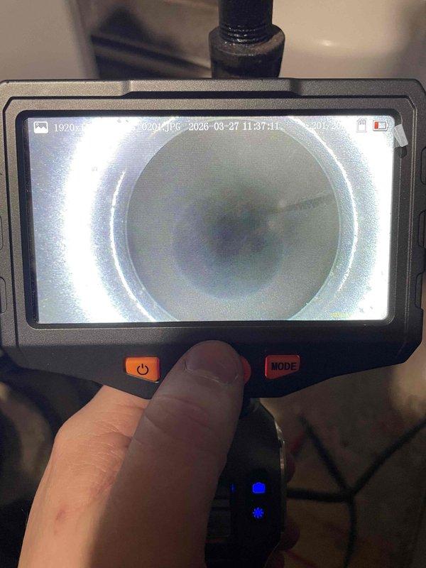 Responded to heating maintenance call regarding odor coming from furnace during shutdown cycle. Performed thorough inspection of air handler and heat exchanger using borescope camera to examine internal components and ductwork for potential sources of smell. Visual inspection revealed no visible cracks, debris accumulation, or contamination within the heat exchanger or connected ductwork that would account for reported odor.