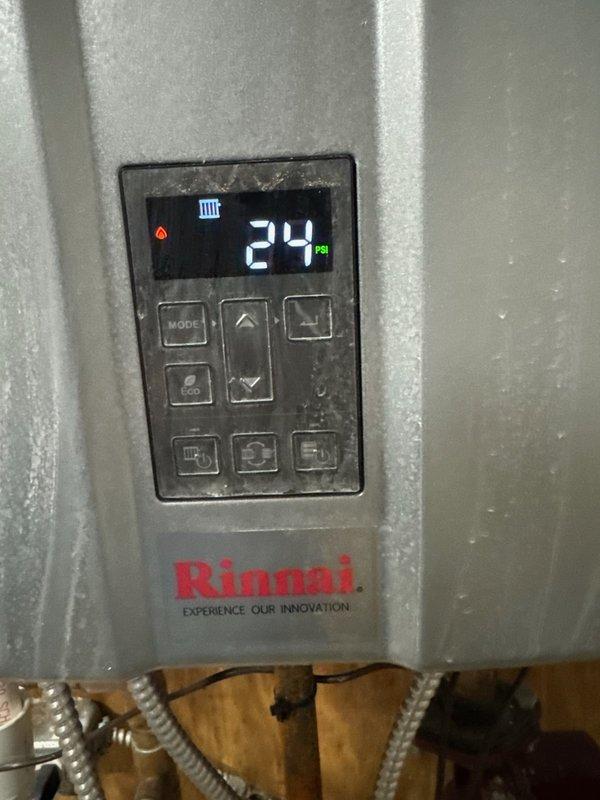 Responded to emergency no-heat call on 7-year-old Rinnai boiler system that lost hot water function following previous day's service visit. Upon arrival, found unit displaying error code 24 on digital control panel. Inspected installation, verified proper gas supply and venting connections, and reset system parameters through control interface. Cycled unit through full operational sequence, confirmed ignition, verified flame sensor operation, and restored hot water production to normal operating specifications.