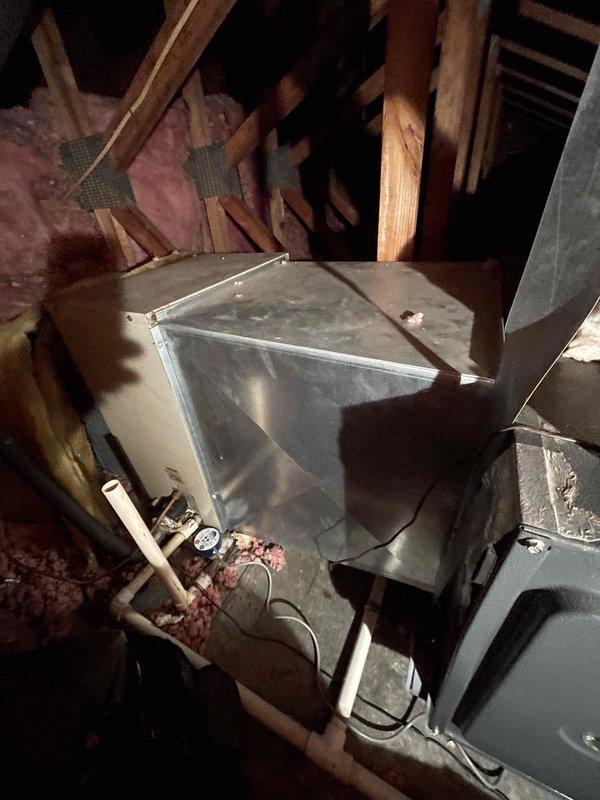 Responded to emergency no-heat call at residential condo with indoor temperature at 58°F. Accessed original 1987 furnace unit located in ceiling closet using available ladder. Upon inspection, found aging furnace system installed in attic space with deteriorated components and compromised functionality. Evaluated complete HVAC system including metal cabinet assembly, plenum connections, and electrical wiring. Documented equipment condition showing significant age-related wear, dust accumulation, and outdated technology. Given the 37-year-old unit exceeds normal service life expectancy and exhibits multiple failure indicators, provided customer with assessment and recommendations for system replacement to restore reliable heating operation.