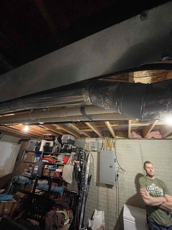 # Tanked Water Heater Leak Assessment

Responded to service call for water heater leaking from bottom with visible pooling underneath unit. Upon arrival, conducted thorough inspection of 22-year-old tanked water heater system in basement location. 

Performed visual examination of tank exterior, connection points, temperature and pressure relief valve, drain valve, and surrounding plumbing fixtures. Assessed water accumulation patterns on floor to determine leak origin point. Inspected tank base and lower sidewall areas for signs of corrosion, rust-through, or structural compromise typical of units approaching end of service life.

Evaluated internal tank condition indicators including age-related sediment buildup and potential anode rod depletion. Checked all inlet and outlet connections for loose fittings or failed gaskets. Tested TPR valve operation and examined discharge tube routing. Verified drain valve integrity and proper seating.

Documented findings with photographic evidence