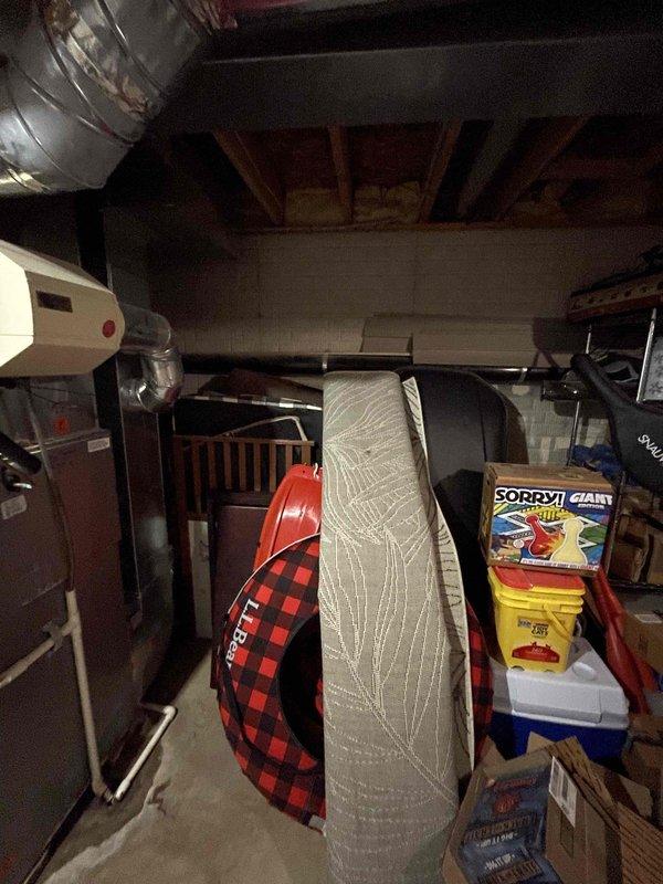 # Tanked Water Heater Leak Assessment

Responded to service call for water heater leaking from bottom with visible pooling underneath unit. Upon arrival, conducted thorough inspection of 22-year-old tanked water heater system in basement location. 

Performed visual examination of tank exterior, connection points, temperature and pressure relief valve, drain valve, and surrounding plumbing fixtures. Assessed water accumulation patterns on floor to determine leak origin point. Inspected tank base and lower sidewall areas for signs of corrosion, rust-through, or structural compromise typical of units approaching end of service life.

Evaluated internal tank condition indicators including age-related sediment buildup and potential anode rod depletion. Checked all inlet and outlet connections for loose fittings or failed gaskets. Tested TPR valve operation and examined discharge tube routing. Verified drain valve integrity and proper seating.

Documented findings with photographic evidence