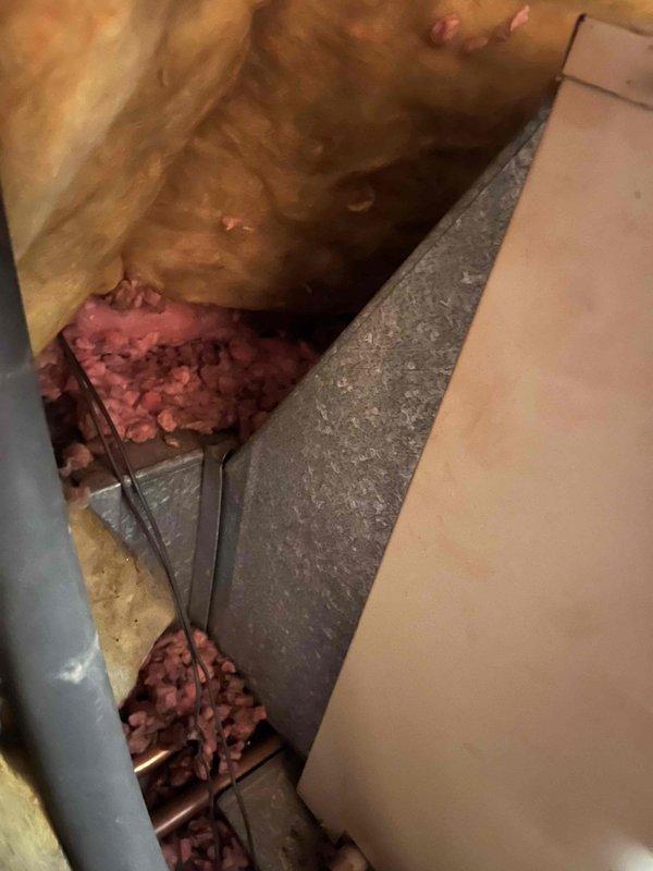 Responded to emergency no-heat call at condominium with indoor temperature at 58 degrees. Accessed original 1987 furnace unit located in ceiling closet using available ladders. Assessed existing heating system and air conditioning equipment for replacement options. Provided estimate for new 80% efficiency furnace and AC system replacement. Documented existing installation conditions including attic space access, structural framing, insulation, and current HVAC equipment configuration through photographic documentation.