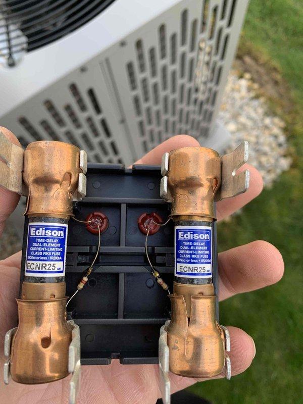 Completed routine cooling maintenance for club member. Inspected and tested electrical components, including dual-element time-delay fuses which showed signs of heat exposure and age-related patina. Measured system amperage at 52.9A using calibrated testing equipment to verify proper electrical operation and confirm unit is running within manufacturer specifications.