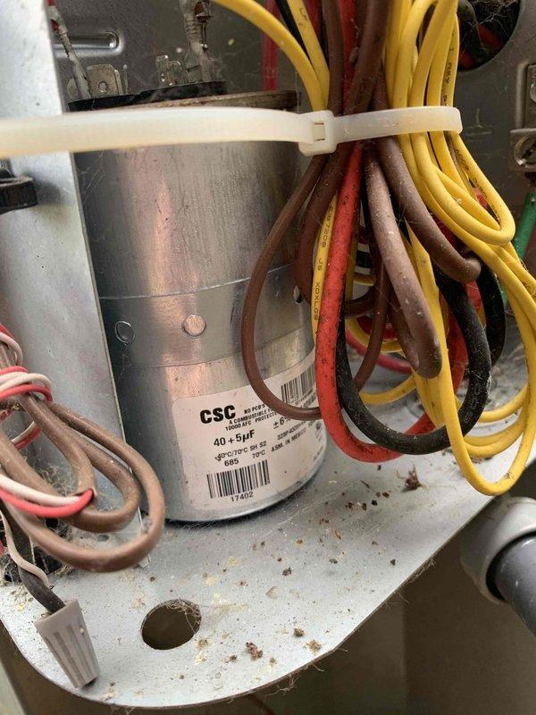 Completed HVAC club membership renewal maintenance visit for air handler unit. Performed system inspection and electrical diagnostics, measuring inrush amperage at 76.81A using calibrated multimeter to verify compressor starting characteristics. Inspected dual-run capacitor rated at 40+5μF, confirmed proper mounting and electrical connections with all wire terminations secure.