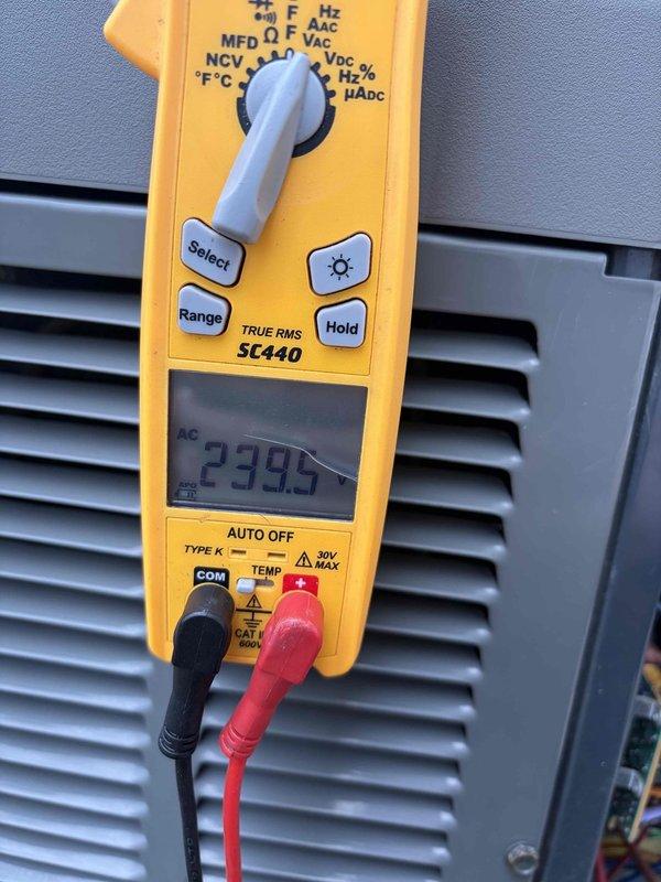Completed cooling maintenance club visit on air handler system. Performed comprehensive inspection of electrical components including disconnect box and control systems, verified proper voltage readings at 234V using calibrated testing equipment, and documented equipment specifications including Intermatic AG2403C surge protection device. All systems operating within normal parameters with no deficiencies noted.