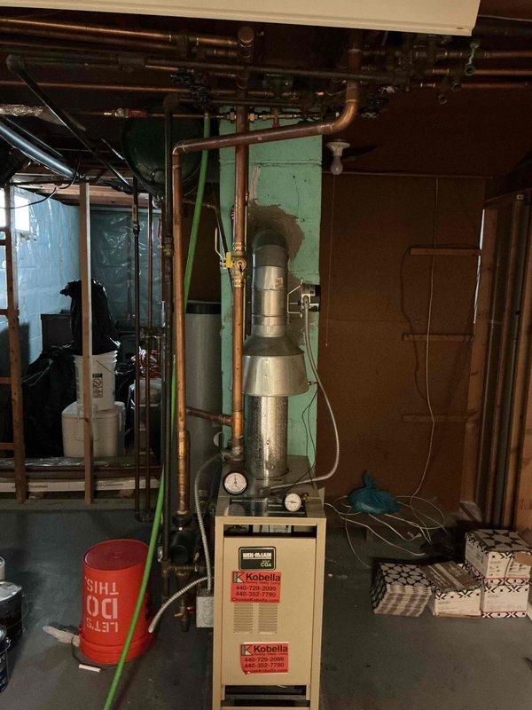Returned to property to complete drain and fill procedure on recently installed boiler system. Successfully drained existing water from boiler and hydronic heating system, flushed lines to remove sediment and debris, and refilled system with fresh water. Verified proper water level in expansion tank, checked all copper piping connections for leaks, and confirmed system pressurization was within manufacturer specifications. System tested and operating correctly upon completion.