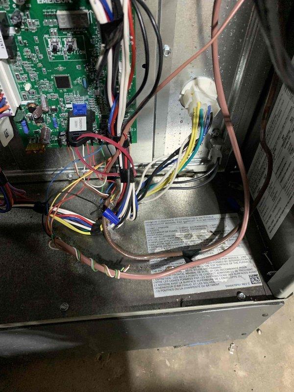 Responded to service call for water intrusion around HVAC unit during heavy rainfall, with moisture observed leaking from the section connecting to the exterior wall. Performed comprehensive inspection of furnace and air handler with system powered off as a safety precaution. Examined control board, wiring harness, and electrical connections for water damage or corrosion. Inspected refrigerant lines, condensate drainage system, and exterior wall penetration point to identify source of water entry. Used inspection camera to evaluate internal components and document conditions. All electrical connections, wire nuts, and control board components appeared dry with no visible water damage or short-circuit indicators. Verified integrity of unit housing and identified potential seal failure at wall penetration as likely entry point for rainwater. System deemed safe for operation after thorough inspection with recommendation for proper sealing of exterior wall penetration to prevent future wat