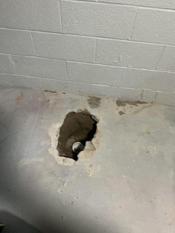 Responded to complete a broken clay drain pipe repair in basement after original technician was unable to finish the work. Upon arrival, assessed the damaged section of clay drain pipe at floor level where it had deteriorated and required replacement. Excavated around the affected area and removed the broken clay pipe section. Installed new PVC drain piping with proper fittings to connect to the existing plumbing system. Ensured all connections were secure and properly sealed to prevent future leaks. Tested the drain line for proper flow and verified no leaks were present at joints or connections. Backfilled and patched the concrete floor opening around the repaired drain pipe. Left the work area clean with all plumbing functioning properly and the basement drain system restored to full operation.