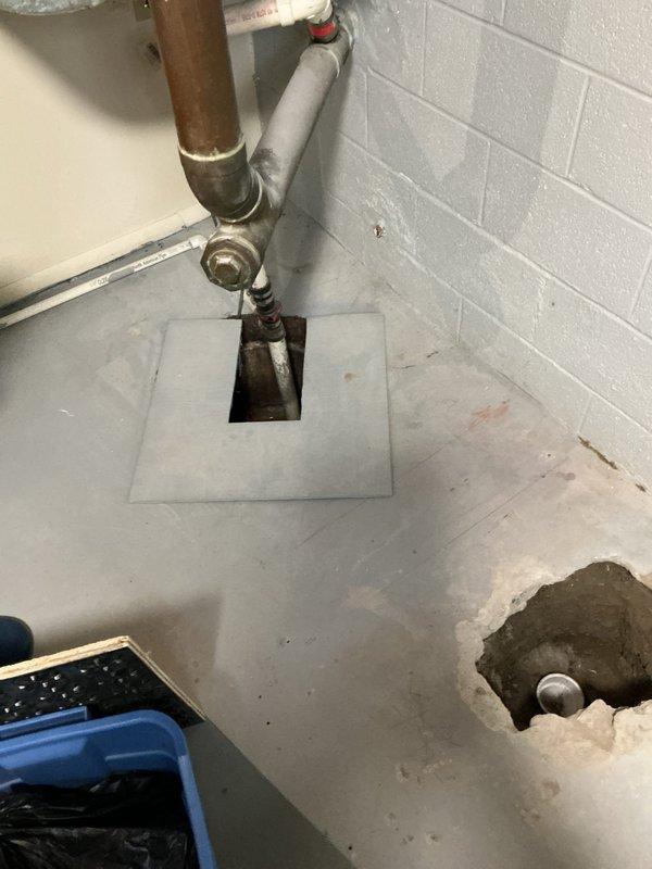 Responded to complete a broken clay drain pipe repair in basement after original technician was unable to finish the work. Upon arrival, assessed the damaged section of clay drain pipe at floor level where it had deteriorated and required replacement. Excavated around the affected area and removed the broken clay pipe section. Installed new PVC drain piping with proper fittings to connect to the existing plumbing system. Ensured all connections were secure and properly sealed to prevent future leaks. Tested the drain line for proper flow and verified no leaks were present at joints or connections. Backfilled and patched the concrete floor opening around the repaired drain pipe. Left the work area clean with all plumbing functioning properly and the basement drain system restored to full operation.