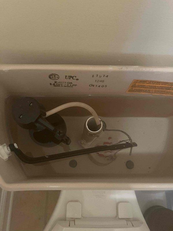 Responded to service call for multiple plumbing issues in residential property. Inspected toilet tank for reported slow leak, removed tank lid and examined fill valve assembly, flush valve mechanism, and flapper valve for proper operation and signs of deterioration. Assessed refill tube connection and overflow tube functionality. Evaluated second bathroom bathtub drain stopper mechanism that was not closing properly, identifying issue with drain assembly operation. Documented conditions of plumbing fixtures with photographs for service records.