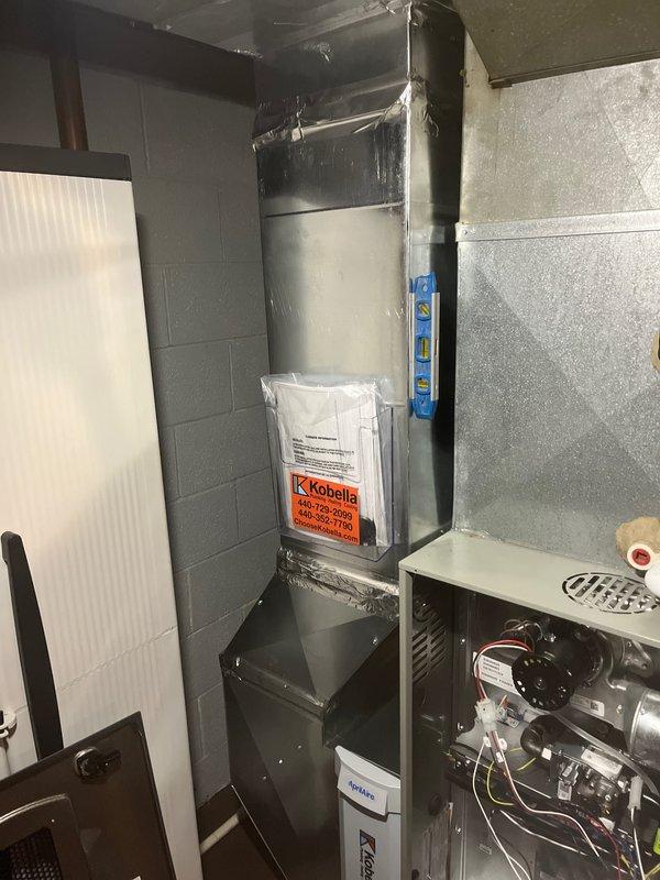 Completed furnace installation in mechanical room as previously sold. New gas furnace unit installed and connected to existing ductwork system. All electrical connections made, gas line attached, and venting properly configured. System tested and verified operational with supply air temperature reading 204.7°F, confirming proper heat exchanger function. Documentation packet placed on unit and installation materials secured for customer reference.