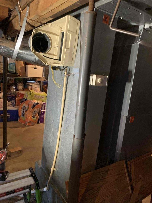 Installed Model 620 water-efficient bypass humidifier on existing Airtemp furnace system in basement utility area. Connected humidifier to supply plenum with appropriately sized ductwork, established water supply line connection, and integrated humidistat control with furnace operation. Verified proper airflow through bypass configuration, tested water flow and drainage, and confirmed system cycling operates correctly with heating system.