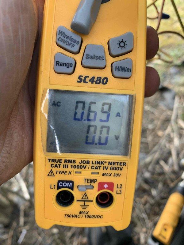 Completed cooling maintenance club visit on air handler system. Inspected and documented air filter condition, which showed moderate dust and debris accumulation requiring attention. Performed electrical diagnostics using digital multimeter, recording amperage draw of 0.69A and verifying proper voltage readings on the system to ensure safe and efficient operation.