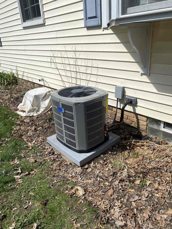 Completed air conditioning system installation at residential property. New outdoor condenser unit was installed on concrete pad with proper leveling and positioning against exterior wall. Electrical disconnect box was mounted to siding with appropriate conduit run to unit. Refrigerant lines were connected and secured with shutoff valves installed for future service access. Indoor air handler components were installed and connected to existing ductwork. System was pressure tested, evacuated, and charged to manufacturer specifications. All electrical connections were completed per code requirements. Unit was started up, tested for proper operation, and verified for correct airflow and temperature differential across the coil.