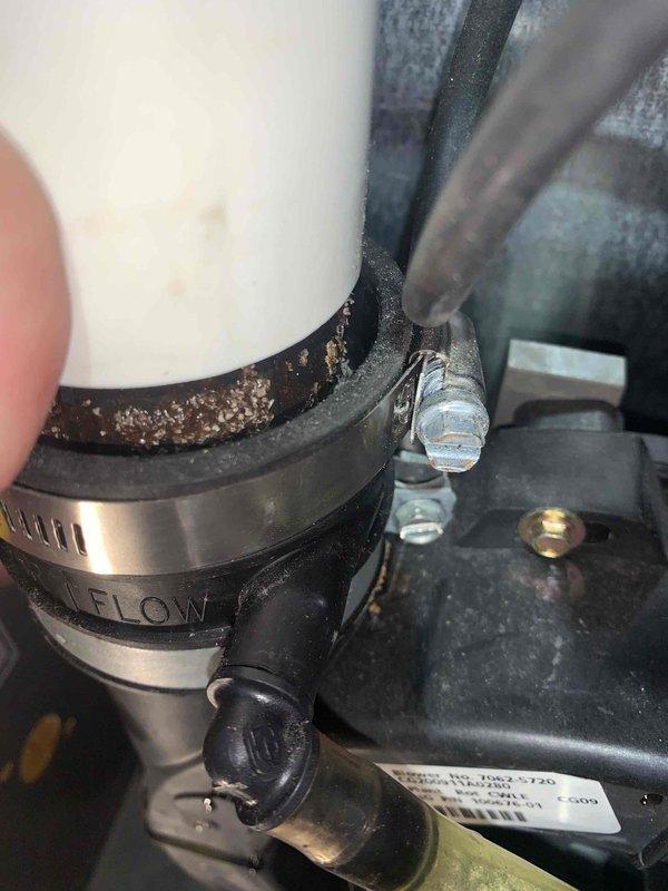 Responded to no heat call on 13-year-old furnace. Upon arrival, performed diagnostic testing using digital manometer to measure gas pressure and airflow parameters. Inspection revealed significant corrosion and mineral buildup on the pressure switch assembly and associated rubber hose connections. The deteriorated condition of the pressure switch hose and clamp assembly was documented, showing crusty deposits indicating prolonged exposure to condensate and moisture. Flow sensor connections exhibited advanced wear consistent with unit age. Testing confirmed pressure switch operation was compromised due to component degradation. Recommended replacement of pressure switch assembly and associated hardware to restore proper furnace operation and ensure safe heating system function.