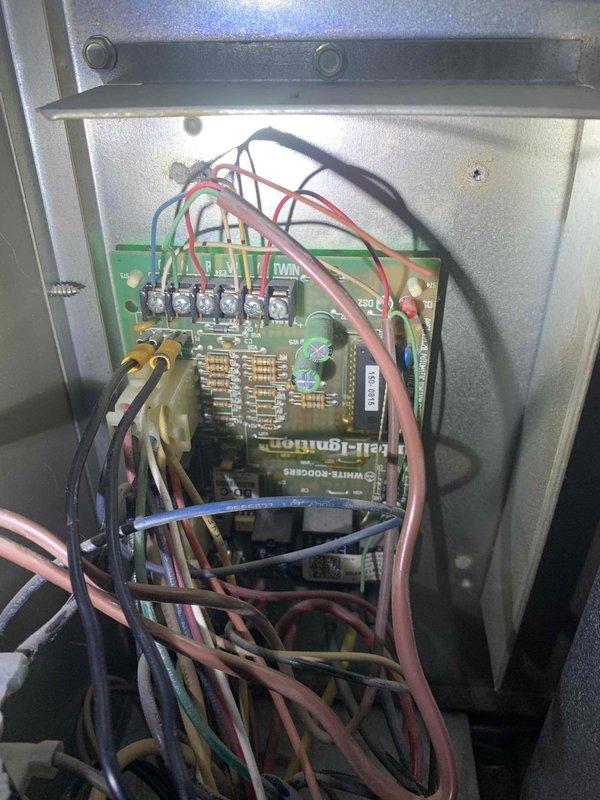 Responded to no cooling complaint on 15-year-old air conditioning system. Upon arrival, performed comprehensive diagnostic evaluation of outdoor condensing unit and electrical control systems. Accessed control panel and inspected internal electrical components, wiring connections, and White-Rodgers control board for proper operation and signs of failure. Checked all wire terminations including power supply connections and low-voltage control circuits.

Evaluated compressor contactor, relays, and capacitor operation. Utilized digital multimeter to test electrical components and verify proper voltage and amperage readings throughout the system. Inspected refrigerant lines and connections for signs of leakage or damage. Connected refrigerant gauges to service ports to assess system pressures and determine refrigerant charge status.

Examined condenser coil condition and noted dirt accumulation consistent with outdoor equipment exposure. Verified proper airflow across coil and checked fan 