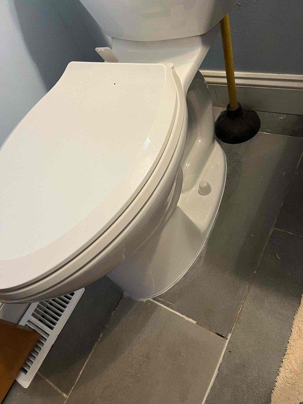 Responded to service call for toilet leaking at base. Upon inspection, identified water seepage from beneath the toilet where it meets the floor, indicating a failed wax ring seal. Removed toilet from floor flange, scraped old wax ring residue, and installed new wax ring. Reset toilet to proper position, secured with closet bolts, and tested for leaks to confirm repair was successful.
