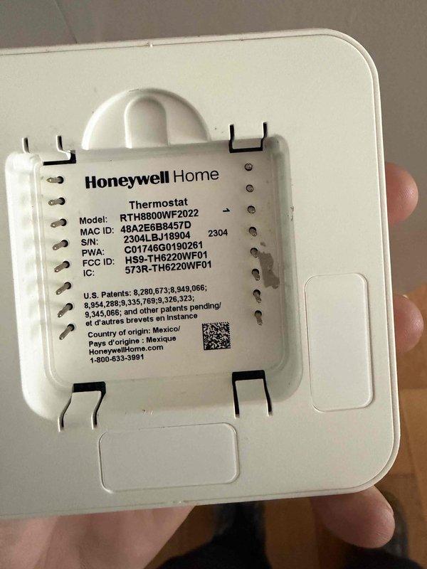 Responded to callback for AC unit running continuously. Upon arrival, found furnace and air handler powered off as reported. Inspected Honeywell Home thermostat model RTH8800WF2022 and identified wiring configuration issues. Removed thermostat faceplate to access terminal connections and verified proper wire connections at Y1, Y2, G, C, R, and Rc terminals. Corrected thermostat wiring and restored power to system. Verified AC unit now cycles properly with thermostat calls. System operating as designed upon departure.