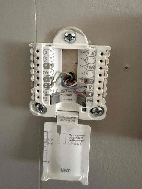 Responded to callback for AC unit running continuously. Upon arrival, found furnace and air handler powered off as reported. Inspected Honeywell Home thermostat model RTH8800WF2022 and identified wiring configuration issues. Removed thermostat faceplate to access terminal connections and verified proper wire connections at Y1, Y2, G, C, R, and Rc terminals. Corrected thermostat wiring and restored power to system. Verified AC unit now cycles properly with thermostat calls. System operating as designed upon departure.