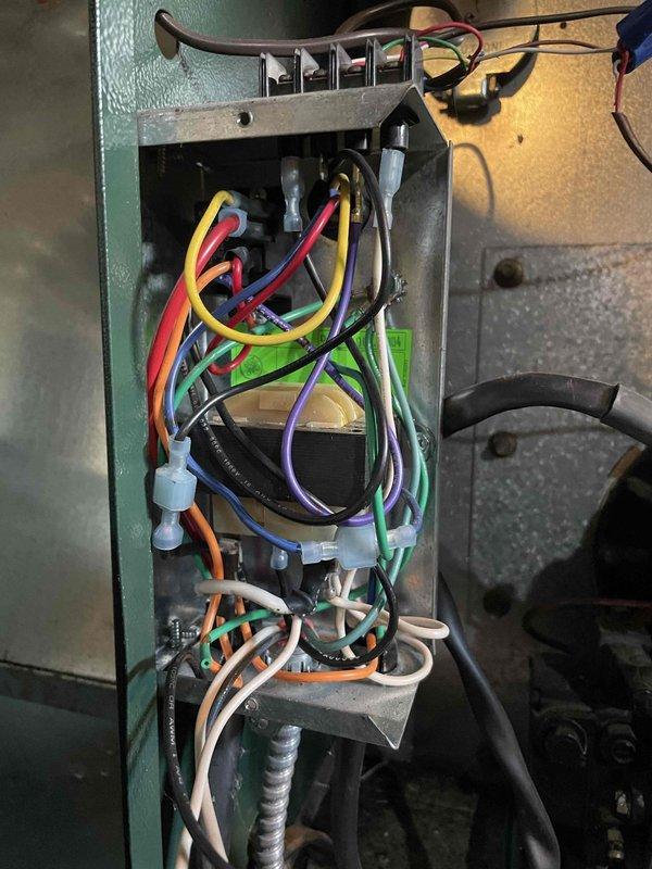 Responded to callback for thermostat installed in November with reported cooling malfunction while heating operated normally. Inspected thermostat wiring at air handler terminal strip and verified all connections were secure and properly terminated to correct terminals. Tested system operation in cooling mode and confirmed air conditioning unit engaged properly with no wiring issues found.