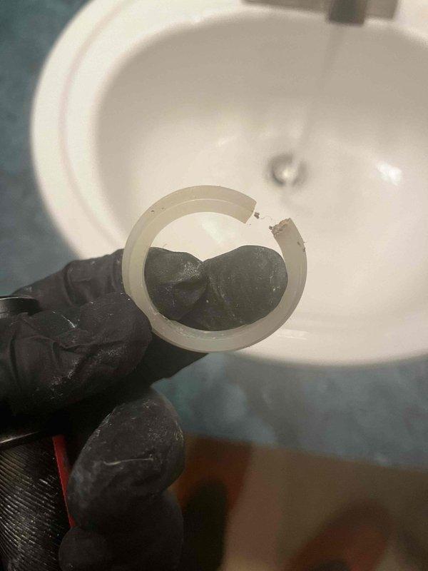 Responded to customer report of water rising in toilet bowl when using bathroom sink faucet. Upon inspection, identified failed wax ring gasket at toilet base allowing improper drainage interaction between fixtures. Removed and replaced deteriorated wax ring seal showing visible wear and compromised integrity. Inspected under-sink plumbing connections including P-trap assembly and tailpiece for proper drainage flow and verified no blockages or leaks present. Tested system after repairs to confirm toilet and sink now draining independently without cross-fixture water backup issues.