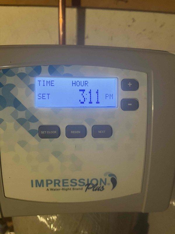 Responded to service call for multiple water leak issues at residential property. Addressed leak under kitchen sink and investigated separate leak in basement area. Upon arrival, discovered basement flooding condition potentially caused by sump pump failure. Inspected water treatment system control panel (Water-Right IMPRESSION Plus unit) to verify proper operation and rule out as potential source of water intrusion. Examined HVAC ductwork and surrounding infrastructure in confined utility spaces to assess extent of water damage and identify leak origins. Documented conditions with photographs for service records. Recommended immediate attention to sump pump system to prevent further flooding and water damage to basement area.