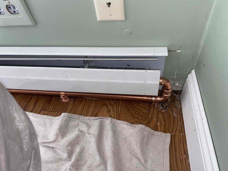 Returned to complete maintenance on Slant Fin baseboard heating system, performing drain and fill procedure on the hydronic heating unit. Coordinated with plumbing contractor throughout the day to ensure proper system operation and integration with existing copper piping and connections.