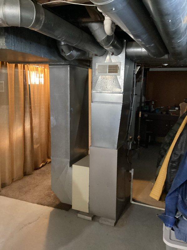 Completed on-site evaluation for air conditioning installation at property with existing furnace air handler system. Assessed current HVAC infrastructure including ductwork configuration and thermostat location, documented equipment specifications and basement utility area layout, and provided comprehensive estimate for new A/C system integration with existing heating components.