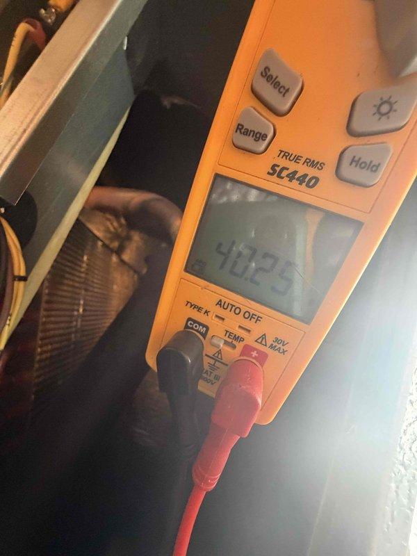 Completed scheduled cooling maintenance on air handler unit. Performed comprehensive system inspection including ductwork evaluation in attic space, verifying proper insulation integrity and configuration. Conducted electrical diagnostics using digital multimeter to test voltage, current, and system performance parameters. All measurements within normal operating range. System operating efficiently with no issues identified.