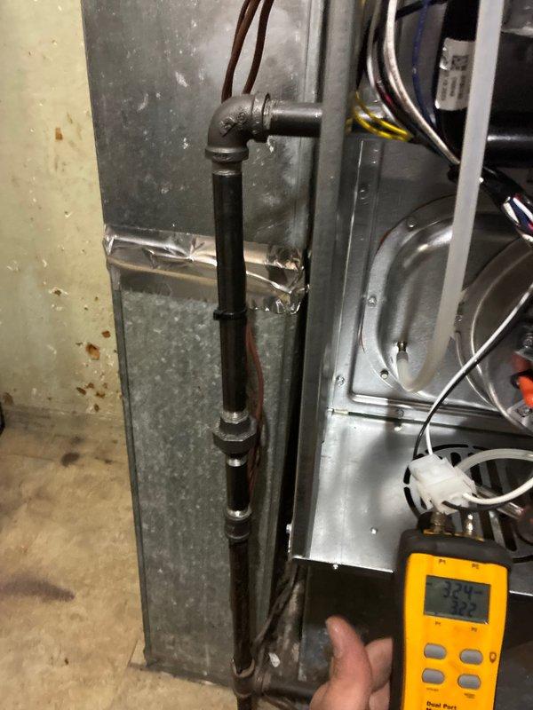 Completed installation of Ameristar 60,000 BTU 80% efficient single stage furnace in basement utility area. Installed and wired control boards, connected all electrical components, verified blower motor operation, routed condensate drain piping, and performed system diagnostics confirming unit operational at 48.9 degrees temperature differential.