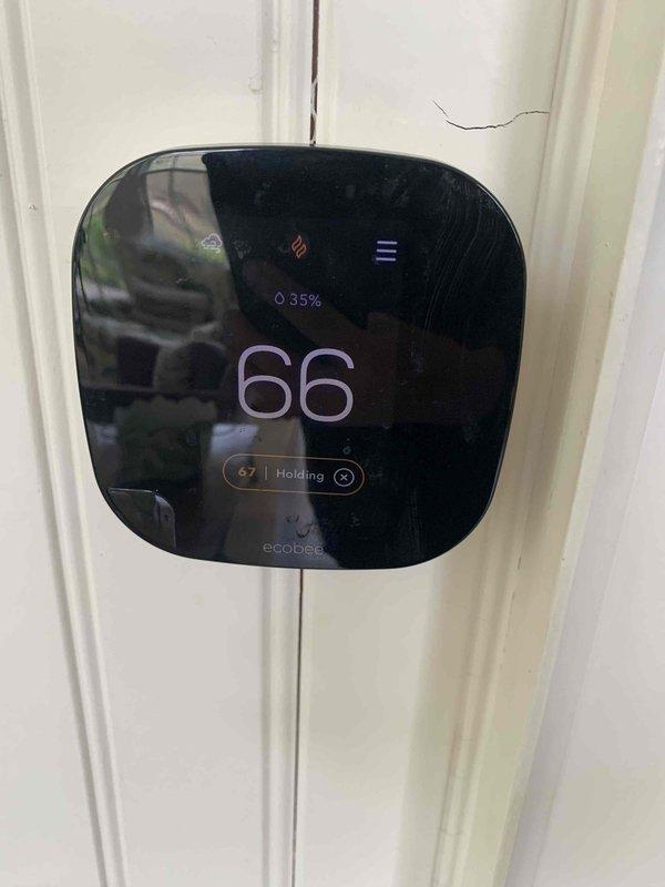 Responded to no-heat call where furnace was not operating and no airflow was present at supply vents. Upon arrival, verified thermostat (Ecobee smart thermostat) was calling for heat and set to 67°F with current temperature reading of 66°F. Performed voltage diagnostics using multimeter to test electrical supply to furnace. Confirmed separate HEPA filtration system was operational, indicating dedicated power circuit was functioning. Troubleshot system components, identified issue, and restored heating operation. Unit tested and verified proper airflow through vents with furnace cycling normally.