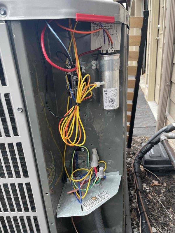 Completed cooling maintenance club visit on residential air handler system. Performed comprehensive inspection of outdoor condensing unit, including removal of electrical access panel to examine internal components. Inspected and documented condition of dual run capacitor, contactor assembly, and all electrical connections. All wiring terminals were secure with no signs of overheating or deterioration noted. Capacitor tested within manufacturer specifications using digital multimeter, displaying proper microfarad readings. Verified proper operation of contactor and relay components. Inspected wire bundling and routing throughout electrical compartment - all connections properly secured and labeled. Indoor air handler unit also inspected, with electrical measurements taken to verify proper system operation. All safety controls and electrical components functioning as designed. System operating efficiently with no deficiencies identified. Unit returned to normal operation upon completion