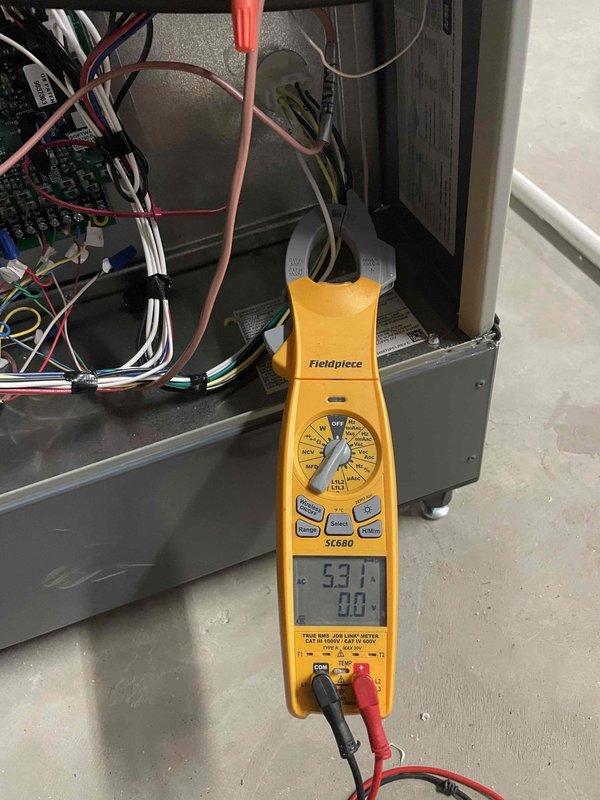Completed cooling maintenance club visit on residential air handler system. Performed comprehensive inspection of outdoor condensing unit, including removal of electrical access panel to examine internal components. Inspected and documented condition of dual run capacitor, contactor assembly, and all electrical connections. All wiring terminals were secure with no signs of overheating or deterioration noted. Capacitor tested within manufacturer specifications using digital multimeter, displaying proper microfarad readings. Verified proper operation of contactor and relay components. Inspected wire bundling and routing throughout electrical compartment - all connections properly secured and labeled. Indoor air handler unit also inspected, with electrical measurements taken to verify proper system operation. All safety controls and electrical components functioning as designed. System operating efficiently with no deficiencies identified. Unit returned to normal operation upon completion