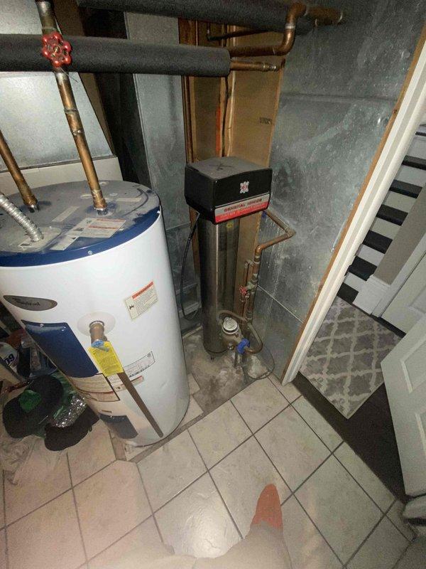 Completed HVAC estimate for heat pump replacement after existing compressor failure. Documented current mechanical room configuration including water heater and plumbing infrastructure, assessed interior space for equipment access and installation requirements. Customer referred by AH.