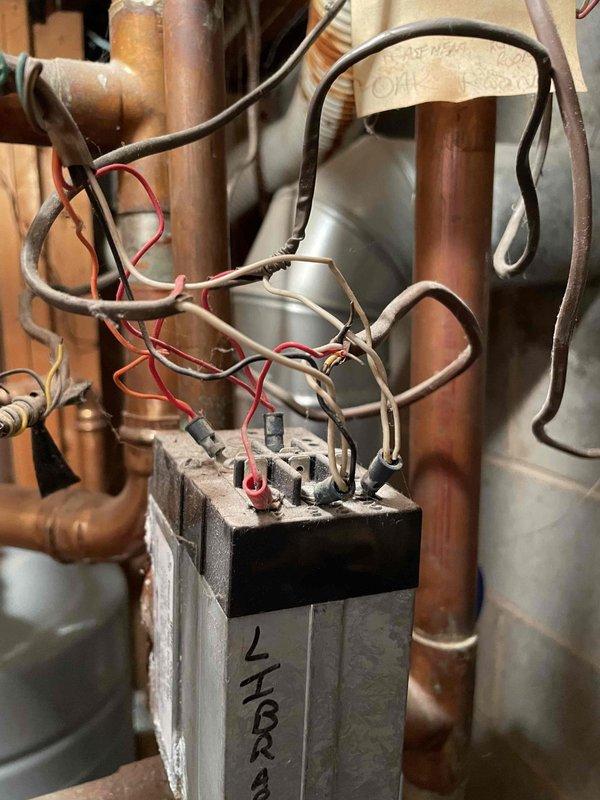 Returned to complete previously sold minimum repair after materials arrived. Installed new expansion tank and pressure relief valve assembly on hydronic heating system. Replaced electrical relay component with new unit, reconnected all wiring to proper terminals, and verified secure connections on all copper refrigeration lines and plumbing connections.