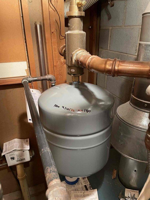 Returned to complete previously sold minimum repair after materials arrived. Installed new expansion tank and pressure relief valve assembly on hydronic heating system. Replaced electrical relay component with new unit, reconnected all wiring to proper terminals, and verified secure connections on all copper refrigeration lines and plumbing connections.