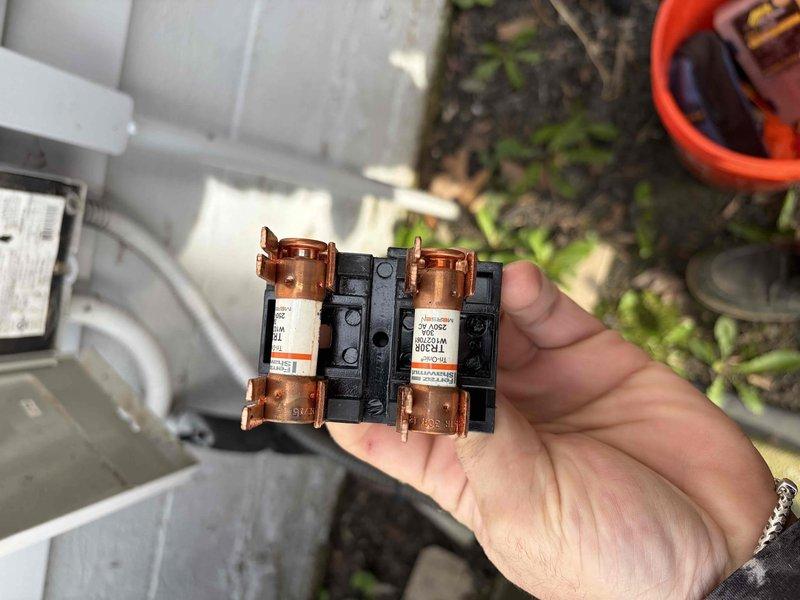 # No Heat Service Call - 10-Year-Old Furnace

Responded to no heat call for residential furnace approximately ten years old. Upon arrival, confirmed unit was not powering on. Performed systematic diagnostic inspection beginning with external electrical components.

Inspected outdoor disconnect box mounted on exterior wall near condensing unit. Removed cover and tested electrical supply to system. Identified blown fuses in exterior disconnect as root cause of no heat condition. Both fuses showed signs of failure with open circuits preventing power delivery to heating system.

Replaced both failed fuses with properly rated replacements per manufacturer specifications. Verified correct amperage rating and voltage compatibility before installation. Secured new fuses in disconnect box and confirmed proper seating of all electrical connections.

Restored power to system and verified furnace operation. Unit successfully initiated startup sequence with ignition, burner operation, and blower ac