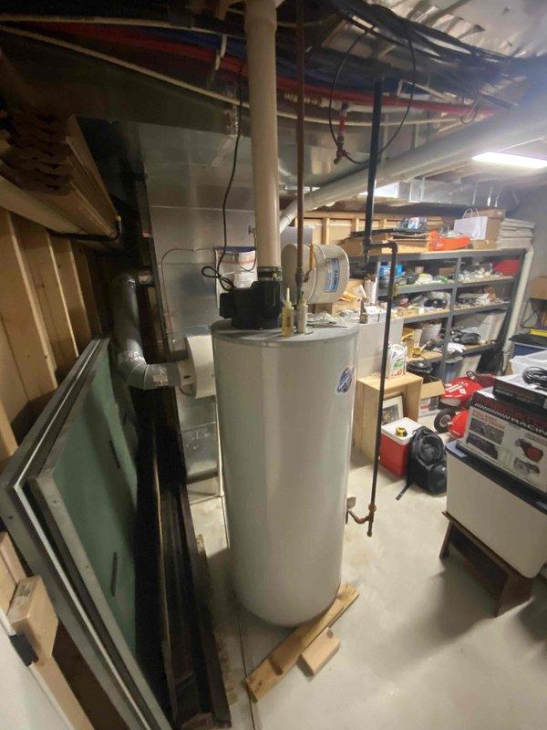 Evaluated existing HVAC system with failed heat pump compressor in residential basement installation. Documented current equipment configuration and utility area conditions to prepare comprehensive replacement estimate for new heat pump system, assessing spatial requirements and existing infrastructure including electrical connections, drainage lines, and clearance specifications necessary for proper installation.