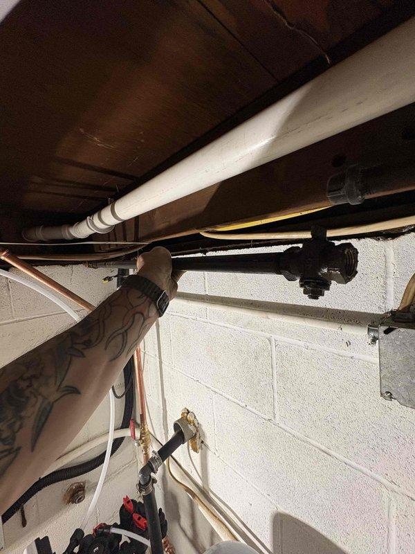 Performed return service call for constant pressure system, well pump, and water softener installation in Arizona. Inspected plumbing connections, pressure tank components, and water supply lines in basement utility area to verify proper operation and system integration. All mechanical components, pipe fittings, and electrical connections confirmed functioning correctly with no leaks or operational issues detected.