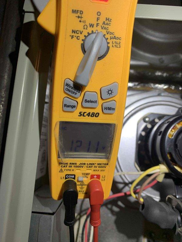 Responded to emergency no-heat call for 11-year-old furnace system. Upon arrival, performed diagnostic testing using digital multimeter to check electrical supply and component functionality. Measured incoming line voltage at 121V and verified proper power delivery to unit. Conducted comprehensive system evaluation including voltage testing across control circuits and component terminals to isolate the failure point preventing furnace operation. Documented findings with diagnostic meter readings showing electrical measurements at key test points throughout the heating system.