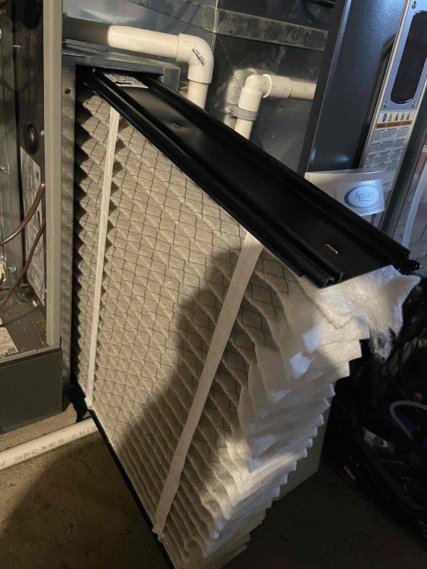 Completed routine cooling maintenance member visit on residential HVAC system. Performed comprehensive system inspection including air handler and furnace unit, verified proper operation of all components, inspected and documented clean pleated air filter with proper fitment in metal frame, checked condensate drain PVC piping for proper drainage and connections, and captured documentation photos of equipment condition. Customer expressed interest in membership renewal following successful maintenance completion.