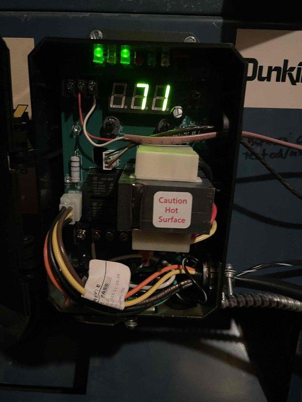 Responded to callback for overheating complaint. Inspected heating system control board and found temperature setpoint display reading 160°F and limit control showing 232°F. Verified transformer operation and checked all wire connections at terminal blocks. Reviewed control sequence operation with digital display reading 0.78 and confirmed all indicator lights functioning properly. System controls and safety devices operating within normal parameters at time of inspection.