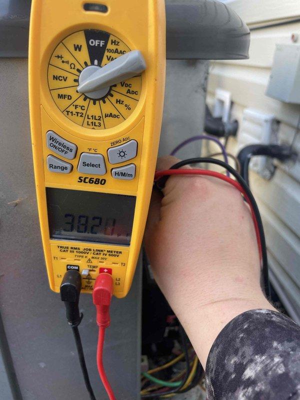 Completed cooling maintenance club visit on air handler system. Performed diagnostic testing using digital multimeter, recording voltage readings of 38.2V at electrical components. Inspected outdoor condensing unit with access panel removed, verifying proper operation of capacitor and electrical connections. All wiring connections secured with appropriate fasteners and diagnostic monitoring device confirmed operational. System tested and found operating within normal parameters.