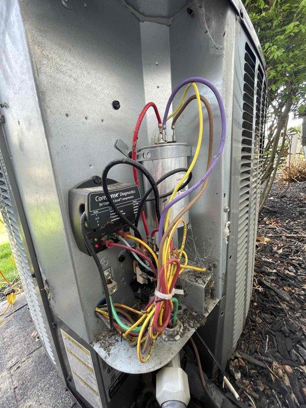 Completed cooling maintenance club visit on air handler system. Performed diagnostic testing using digital multimeter, recording voltage readings of 38.2V at electrical components. Inspected outdoor condensing unit with access panel removed, verifying proper operation of capacitor and electrical connections. All wiring connections secured with appropriate fasteners and diagnostic monitoring device confirmed operational. System tested and found operating within normal parameters.