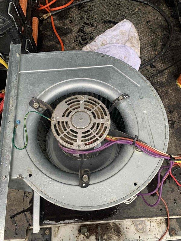 Diagnosed and resolved poor airflow issue caused by failed blower motor assembly in air handler unit. Removed defective blower motor with squirrel cage fan from system, replaced with new assembly, and restored proper air circulation to HVAC system.