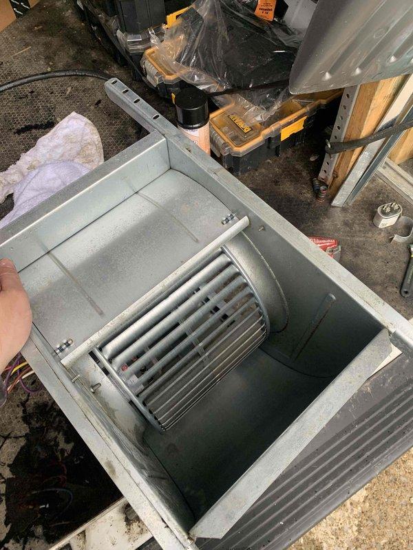 Diagnosed and resolved poor airflow issue caused by failed blower motor assembly in air handler unit. Removed defective blower motor with squirrel cage fan from system, replaced with new assembly, and restored proper air circulation to HVAC system.