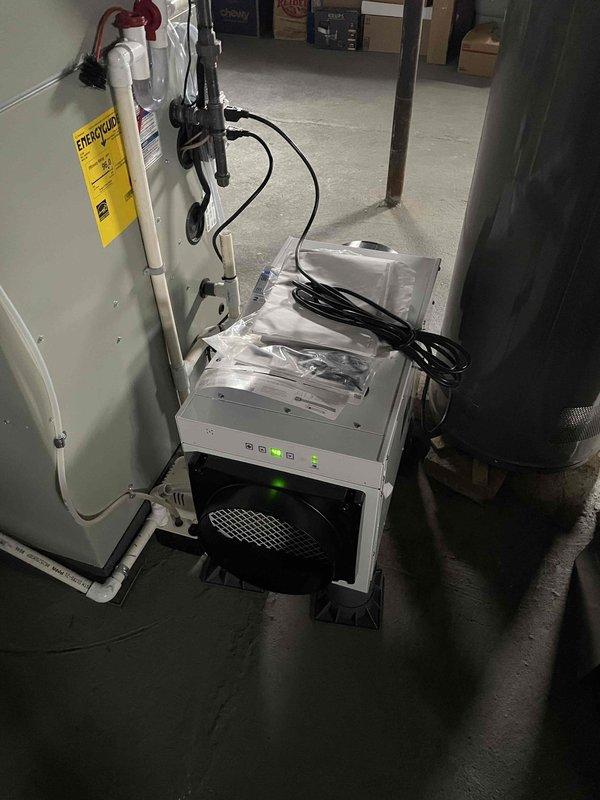 Responded to service call for delayed HVAC control panel responses and malfunctioning dehumidifier control buttons preventing humidity percentage adjustments. Inspected recently installed system (January 2026) including basement-mounted dehumidifier unit with green indicator lights and mesh filter, along with connected furnace/air handler unit with associated ductwork and control components. Documented equipment condition and control interface issues via photographs for warranty claim processing, as system remains within manufacturer warranty period.