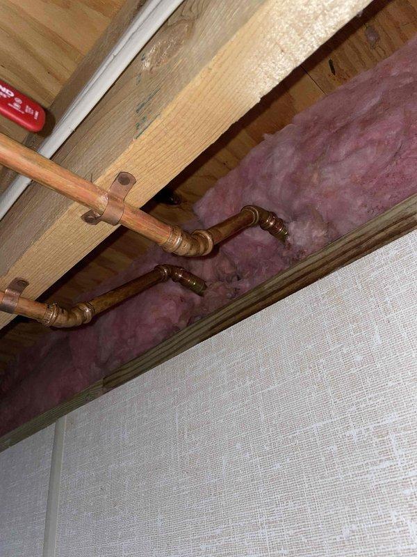 Responded to leaking garage faucets and successfully repaired two outdoor hose bibs mounted on exterior wall. Accessed plumbing connections through ceiling space, inspected copper supply lines and mounting hardware, replaced worn internal components, and tested both fixtures to confirm proper operation with no active leaks upon completion.