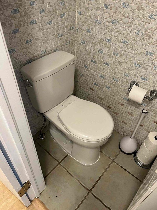 Completed return visit for cracked clay pipe replacement with PVC piping. Installed new toilet in bathroom with mosaic tile walls and performed leak repair behind dryer unit. All plumbing fixtures tested and verified operational upon completion.
